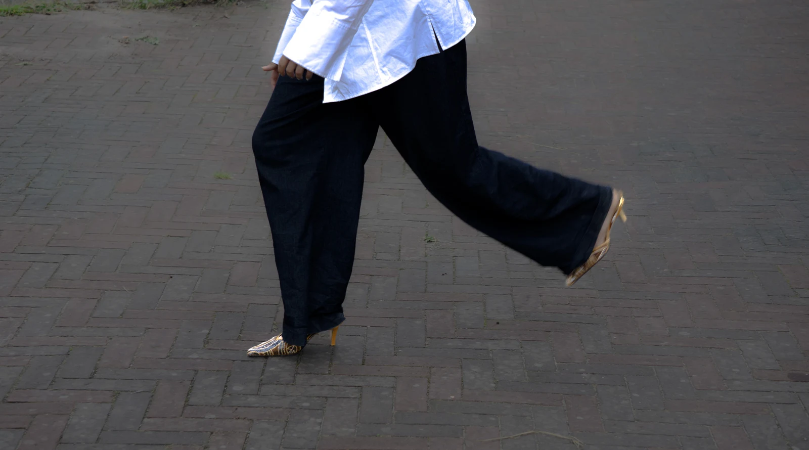 Bijou heels in motion with black trousers