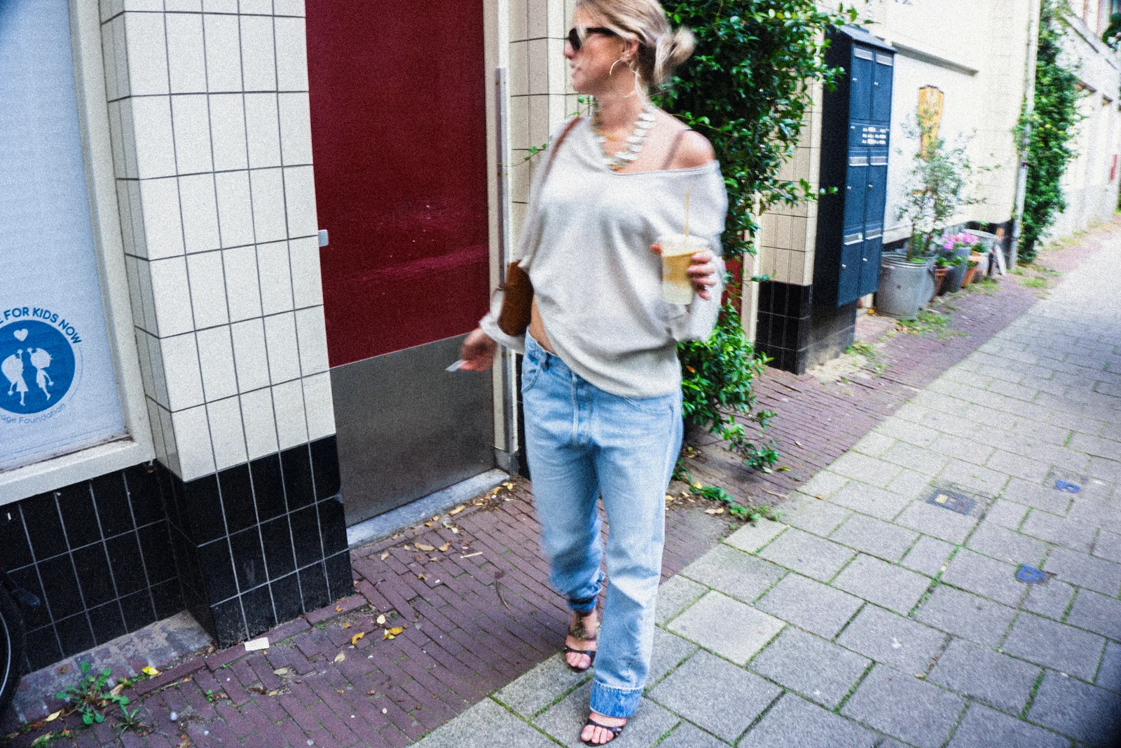 Mosaic heels with jeans and a scarf on a city street