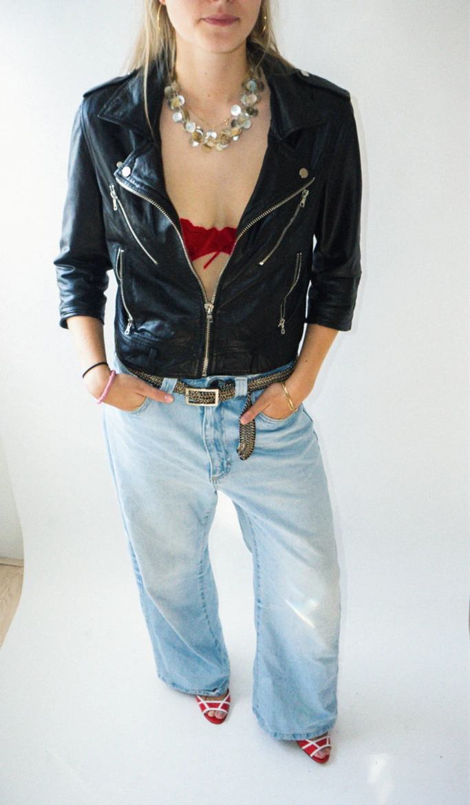 Velou red heels styled with jeans and a black jacket
